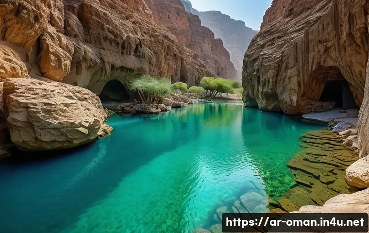 오만 관광 명소 - **"A breathtaking view of Wadi Shab in Oman. The image features crystal-clear turquoise natural pool...